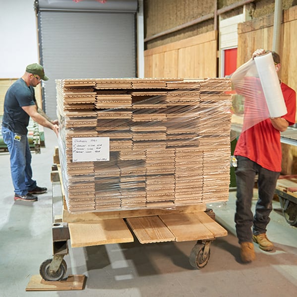 Flooring order being wrapped in plastic for delivery