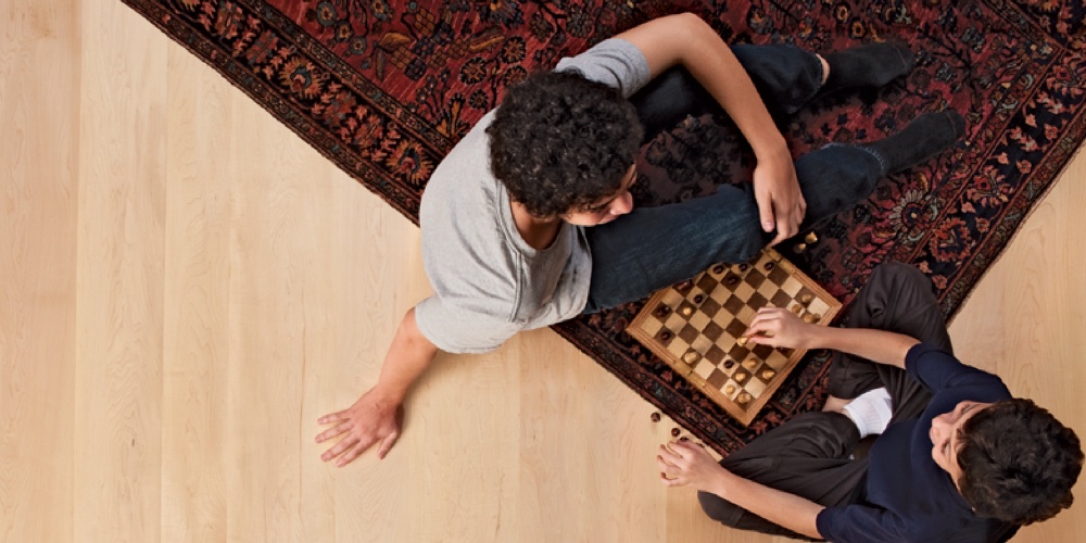 playing chess on maple plank flooring