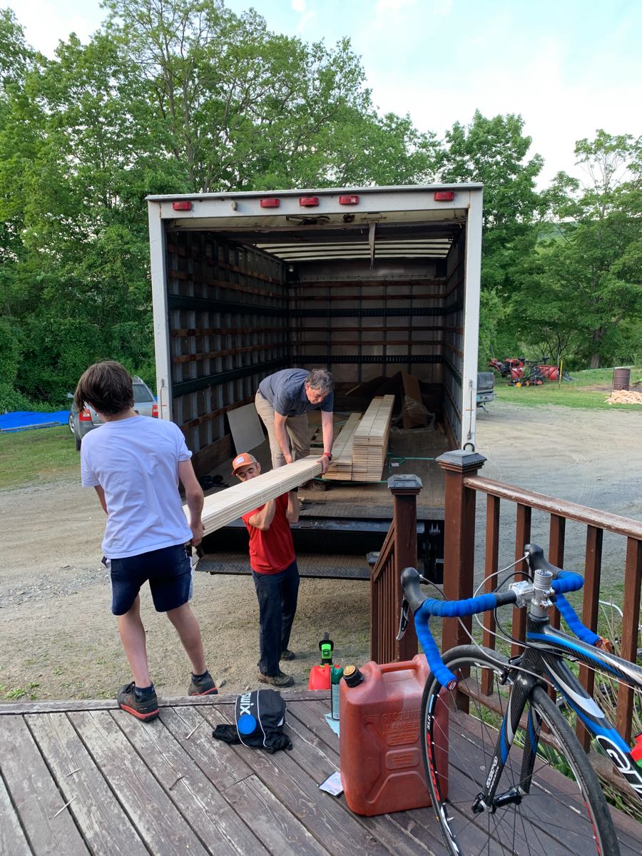 Unloading maple plank flooring from truck