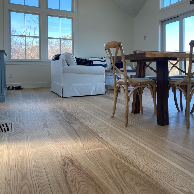 ash flooring in light filled livingroom