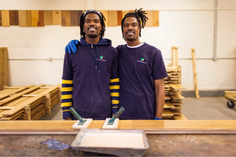 vermont plank aristans pose in front of planks